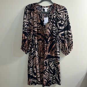 Dress with safari like print. Never worn. Light weight.